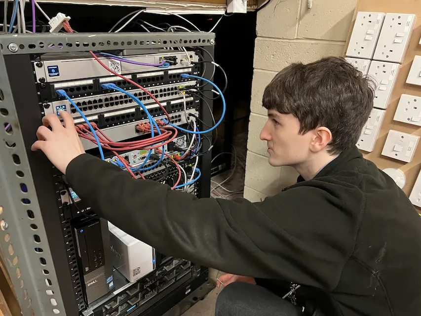 Billy working on lighting control systems in the EGG workshop