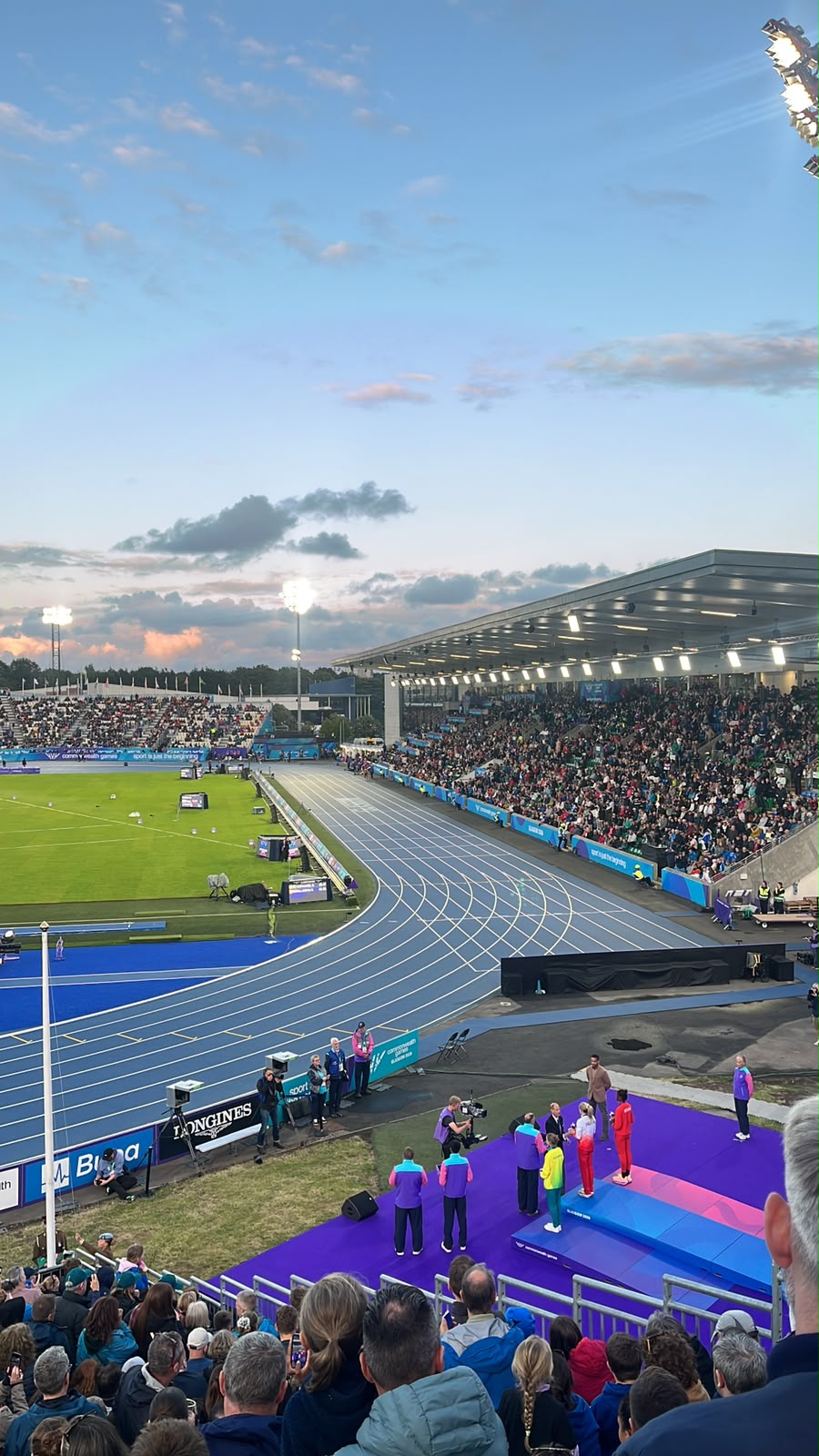 Medal ceremony at Scotstoun under the floodlights during Glasgow 2026