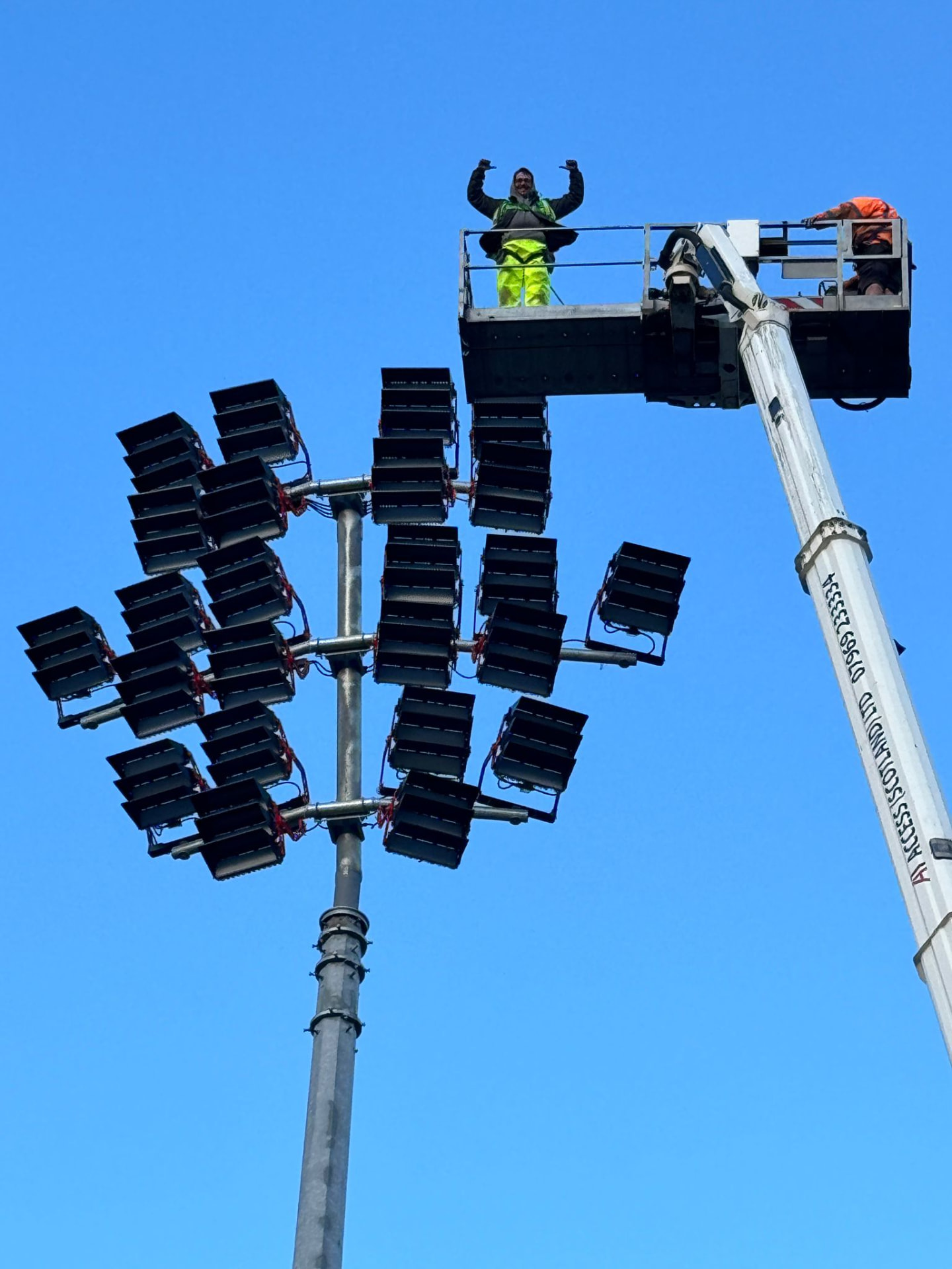 EGG engineer on a MEWP alongside a Scotstoun floodlight mast head frame