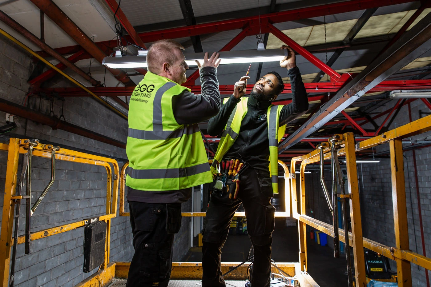 EGG electricians installing a luminaire
