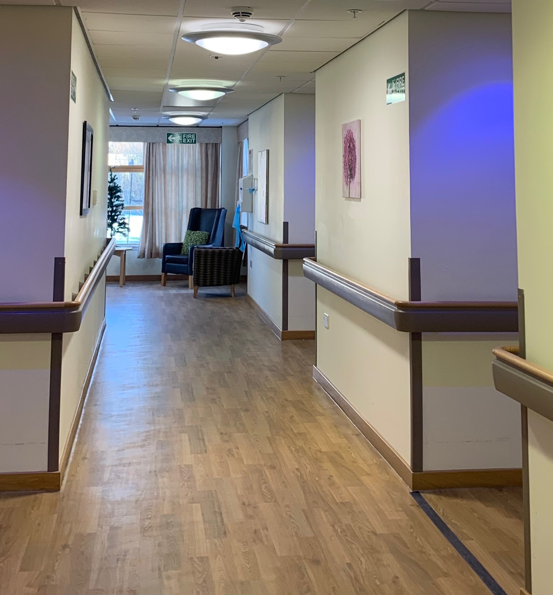 Care home corridor relit with new LED bulkheads while remaining in occupation
