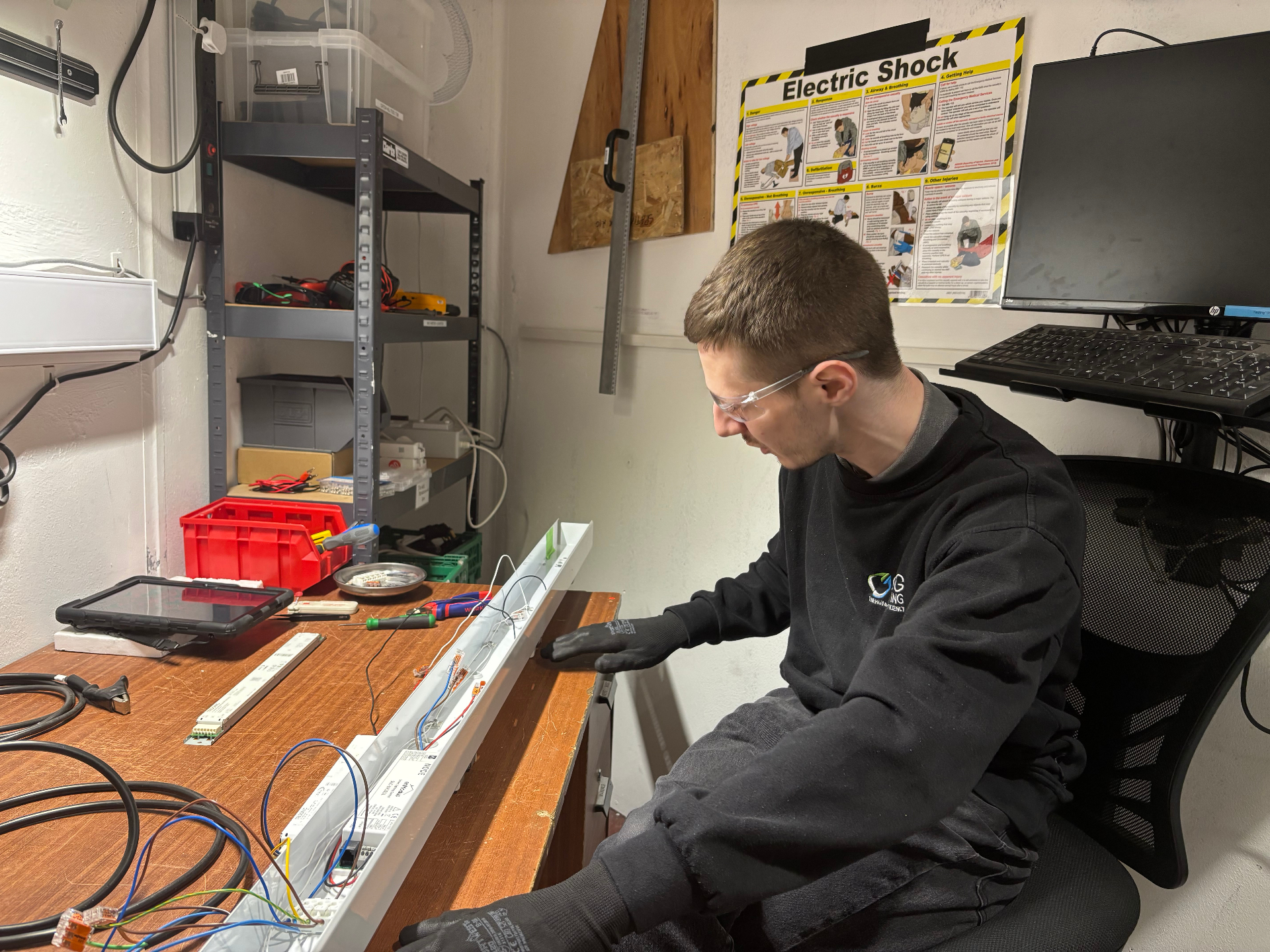 Ben remanufacturing a luminaire in the EGG Lighting workshop — documented, tested and re-certified to BS 8887-221:2024